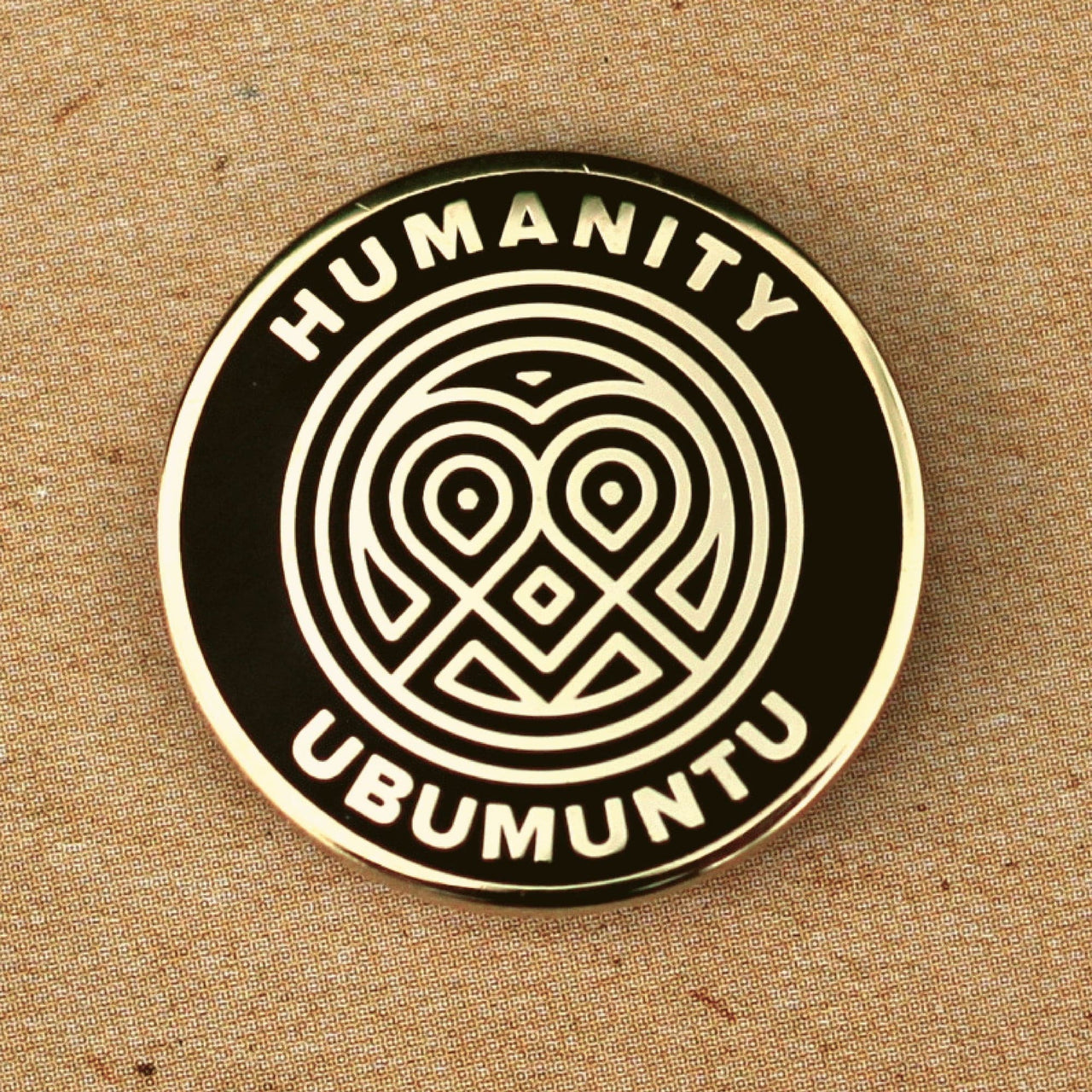 Champion Humanity Lapel Pin Badge.